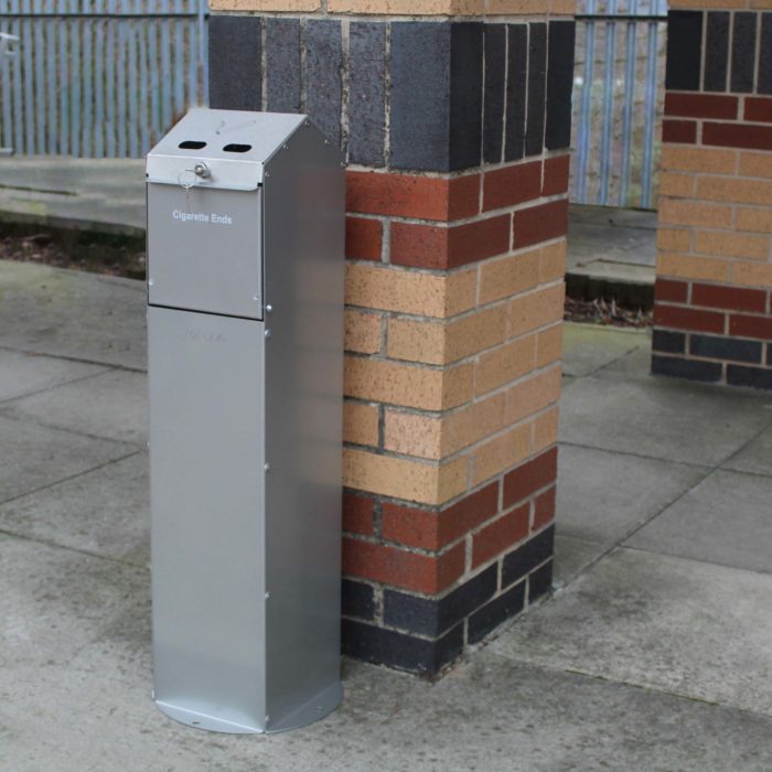 The Tabstand Floor Mounted Pedestal Ashtray has a lockable hinged cigarette end container which pivots forward for ease of emptying into a suitable container.