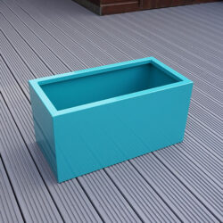 Turquoise Rectangular Flower Planter with no flowers inside.