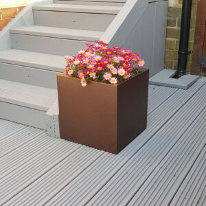 Copper Medium Square Flower Planter with garden decking.