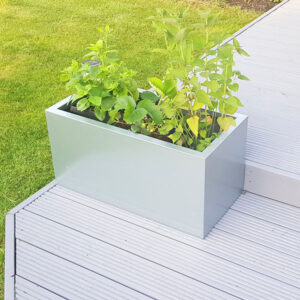 Galvanised Steel Rectangular Flower Planter on garden decking.