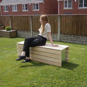 Modular Wood Bench with a woman sitting on it.