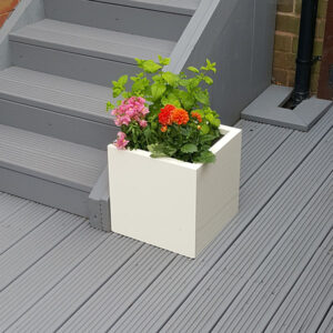 Off White Medium Square Flower Planter on grey garden decking.