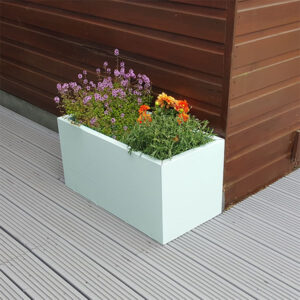 Pastel Green Rectangular Flower Planter next to a brown shed.