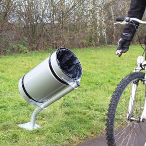 The Tilter Posted Mounted Bridleway Bin with a cyclist going by.