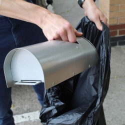 Anti-Vandal Ashtray being emptied.