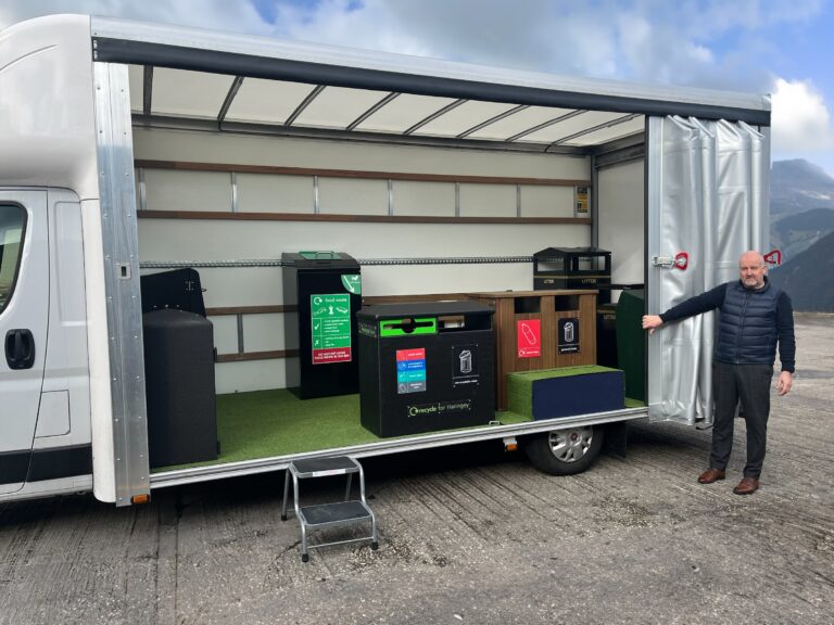 The roadshow van with the door open.