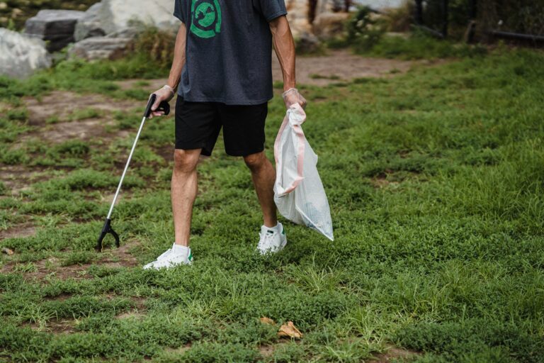A man picking litter.