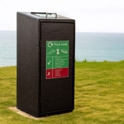Wybone Never Rust Food Waste Wheelie Bin Housing stood in a coastal area