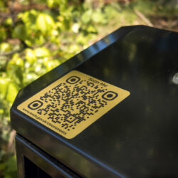 QR code integrated into a Leeds City Council litter bin linking residents to Clean Streets and Litter Free Leeds information.