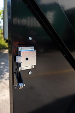 Close-up of the secure locking mechanism on a Wybone Apollo 1280L wheelie bin housing, designed for safe and secure access by authorised maintenance teams.