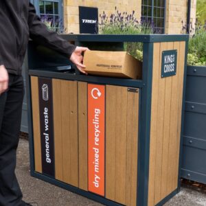 wood bin with dark panels , person putting in parcel into bin