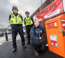 Police next to Wybone knife amnesty bin